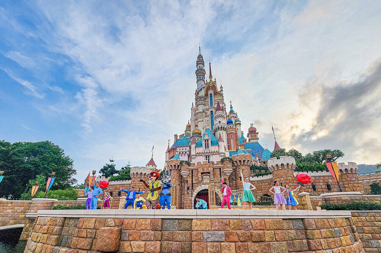 The Castle of Magical Dreams at Hong Kong Disneyland, lit up at twilight