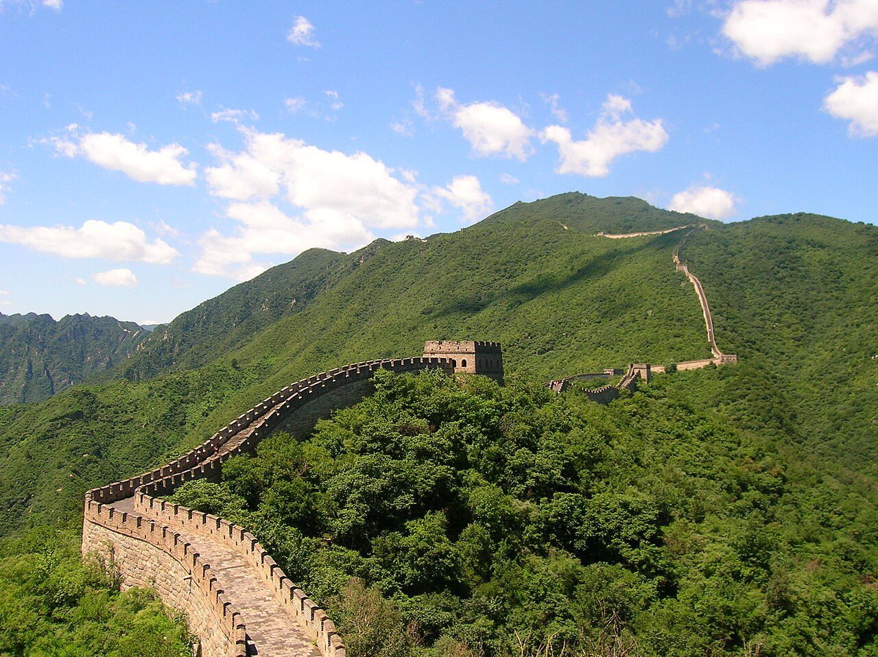 Mutianyu Great Wall watchtowers snaking along forested mountain ridges