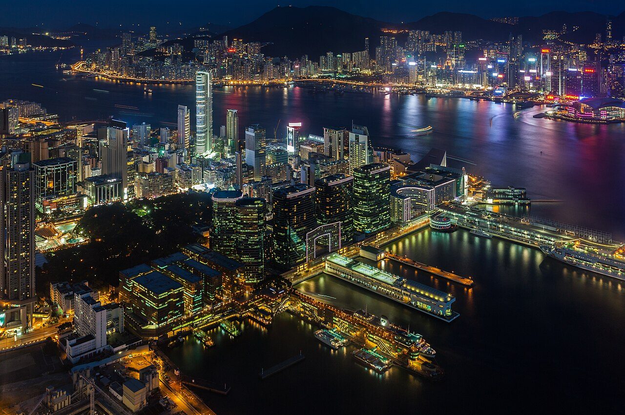 View of Victoria Harbour and Hong Kong Island skyline from the Tsim Sha Tsui waterfront at daytime