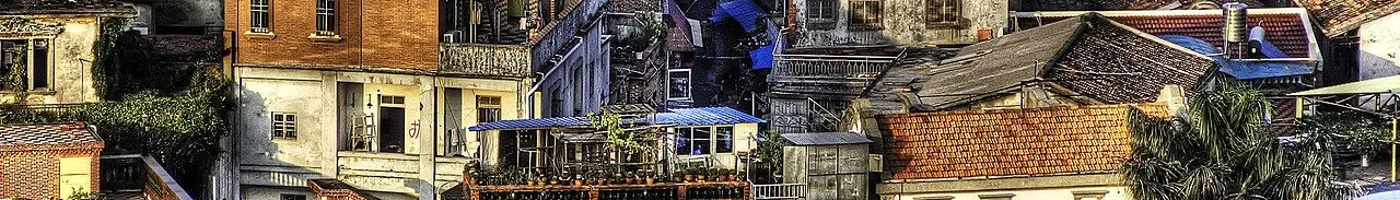 Gulangyu Island aerial view of the colonial-era rooftops — the dense tangle of European-style 19th-century buildings (13 former foreign consulates, churches, and residences) that earned Gulangyu a UNESCO World Heritage listing in 2017