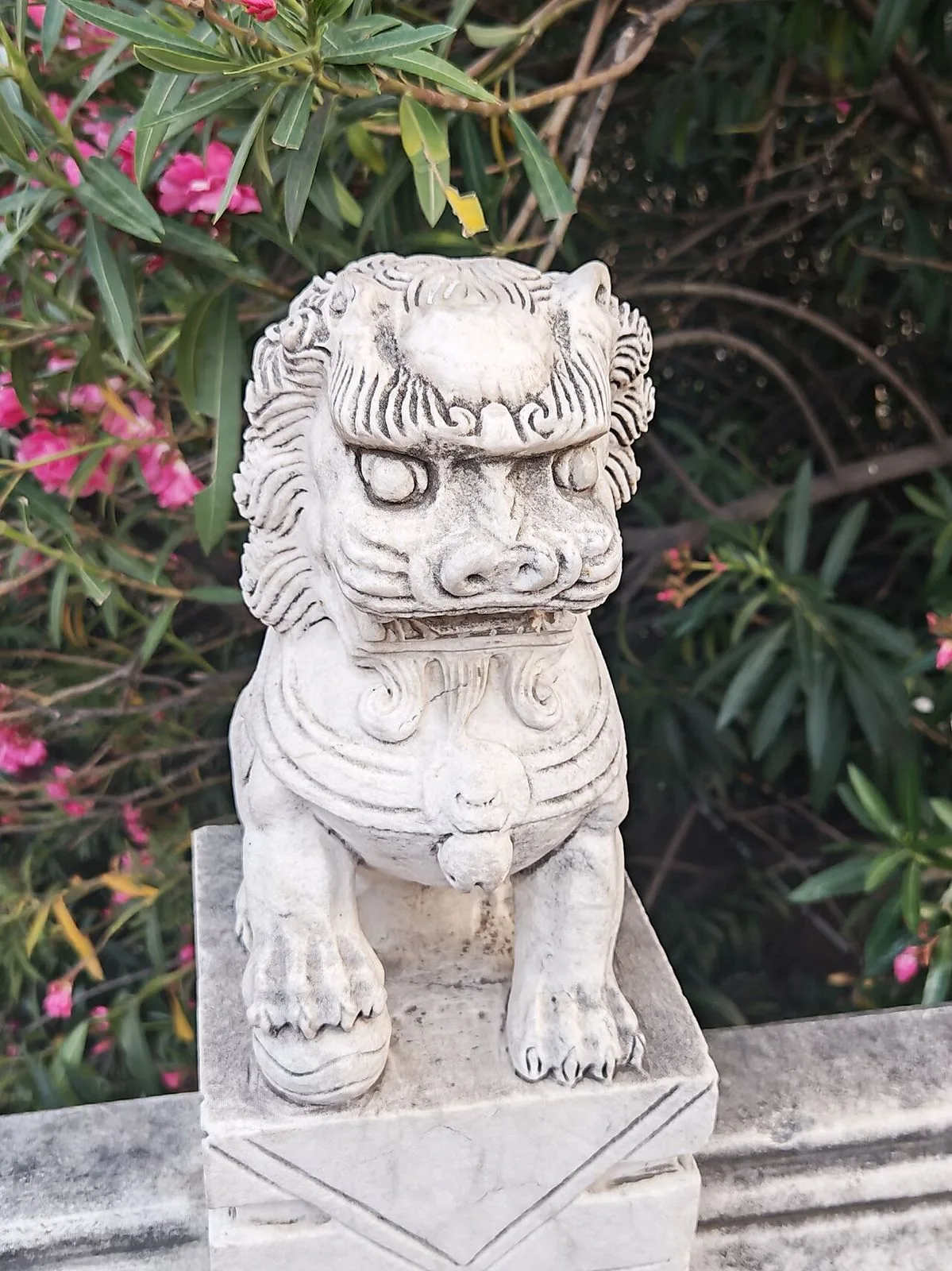 A Ming-dynasty stone lion guarding the Lijing Gate of Luoyang — carved from a single block of limestone in the 14th century, the traditional guardian figure placed at the entrance to the old walled city that served as the eastern capital of China for over 1,000 years across 13 dynasties