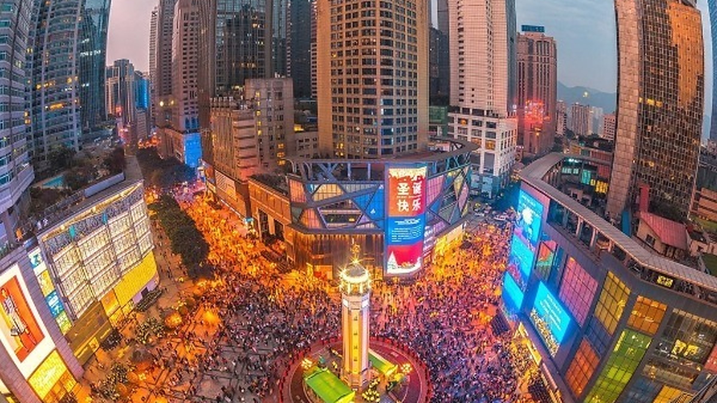 Jiefangbei Liberation Monument and surrounding skyscrapers at dusk, Chongqing