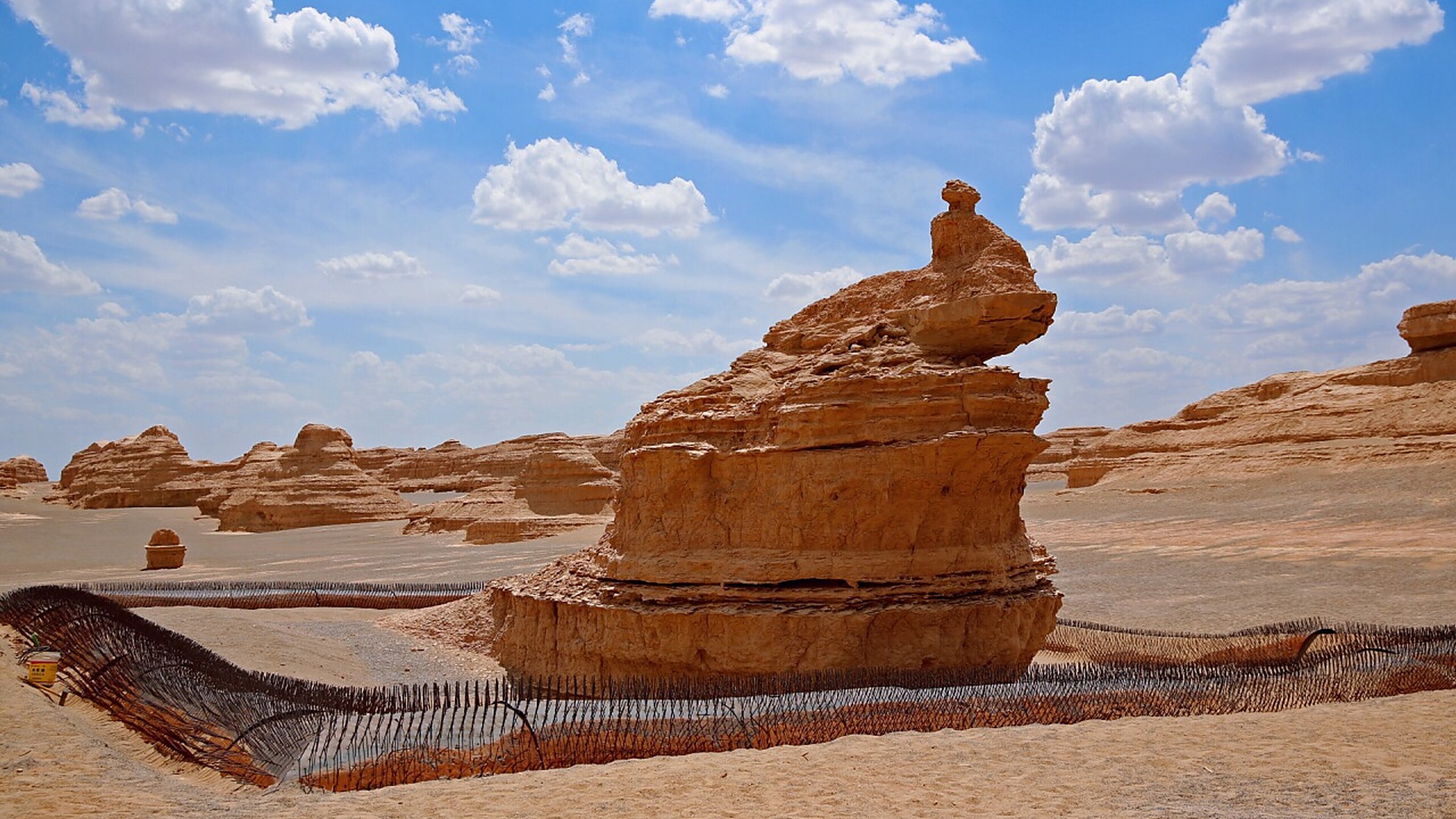 Yardang National Geopark (雅丹魔鬼城) — a 400 km² yardang (wind-eroded rock) field 180 km northwest of Dunhuang, named "Devil's City" for the howling wind through the rock formations.