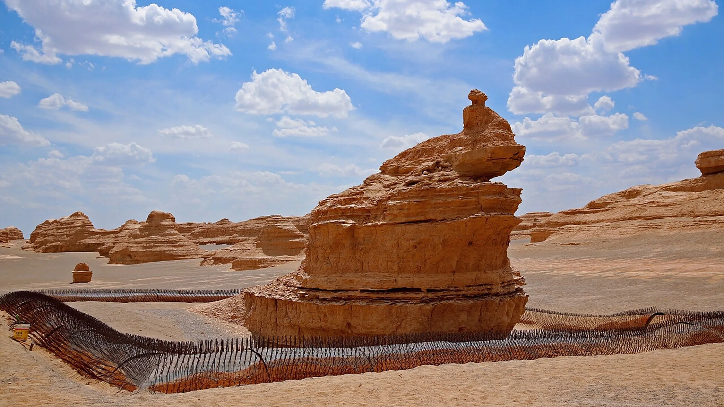 Yardang National Geopark (雅丹魔鬼城) — a 400 km² yardang (wind-eroded rock) field 180 km northwest of Dunhuang, named "Devil's City" for the howling wind through the rock formations.
