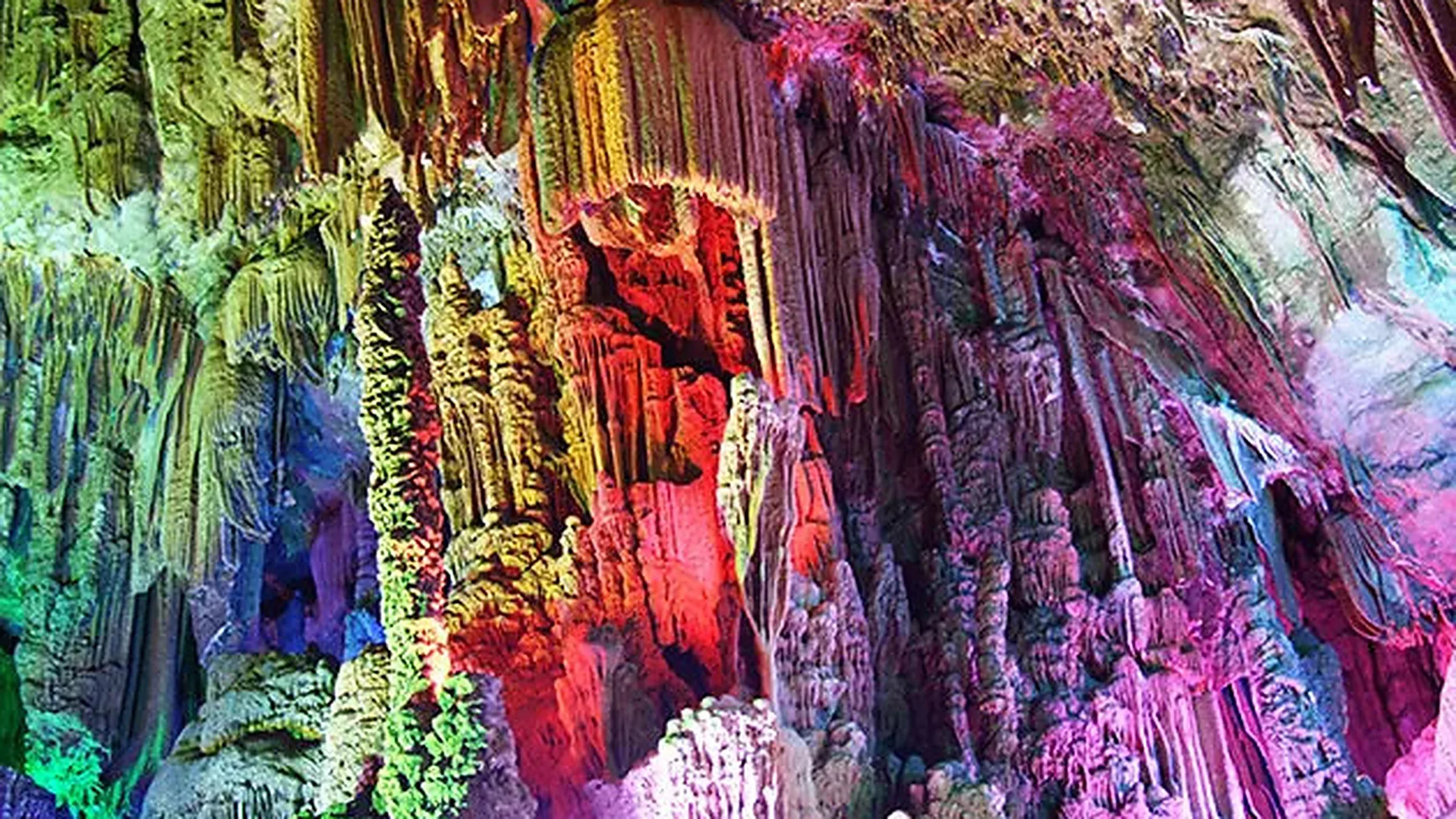 Reed Flute Cave, a 240-meter karst grotto lit with colored lights since the 1940s.