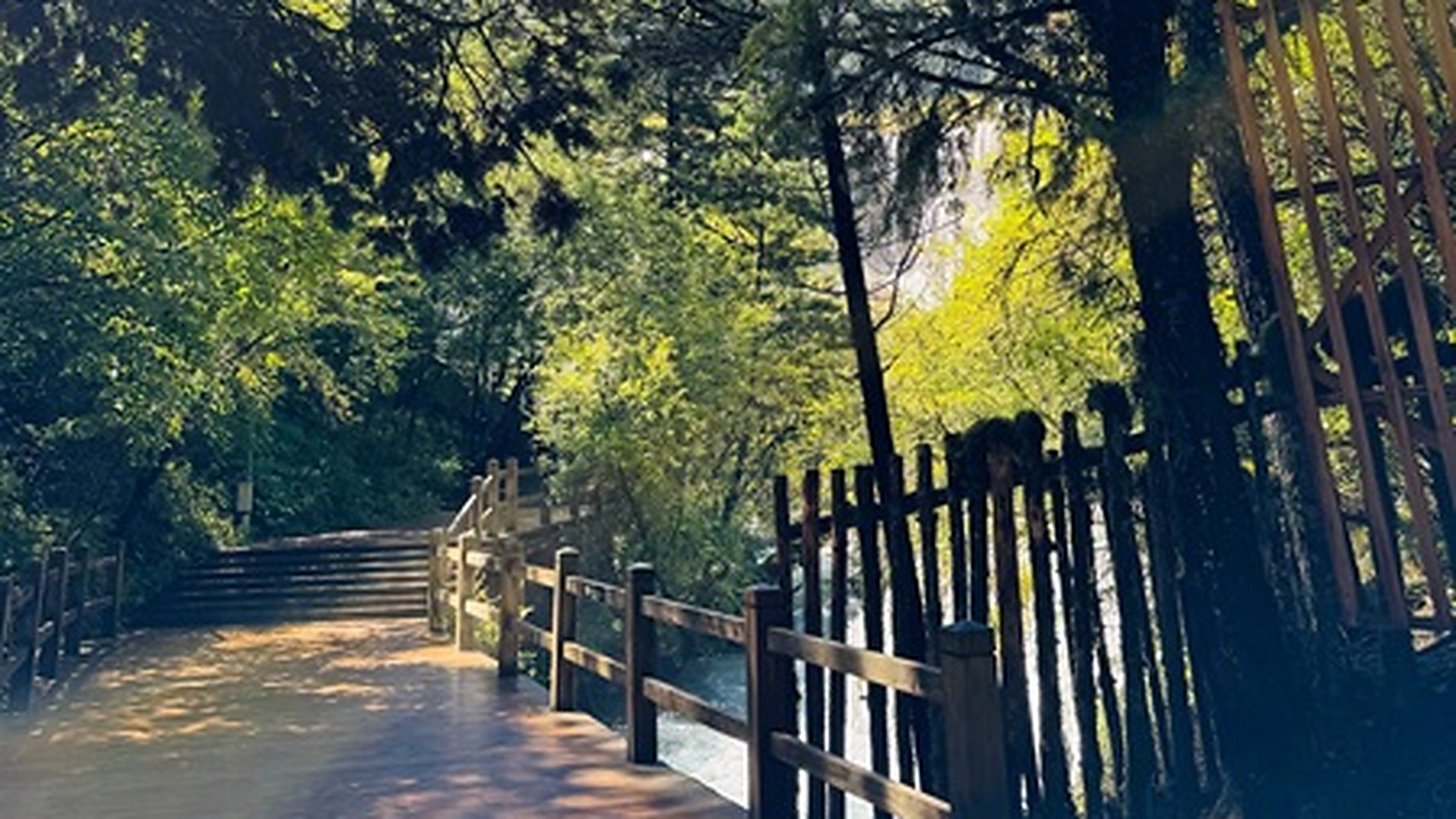 Nuorilang Waterfall (诺日朗瀑布) — at 78m wide and 24m high, the widest travertine waterfall in China, featured in the 1986 Journey to the West TV series.