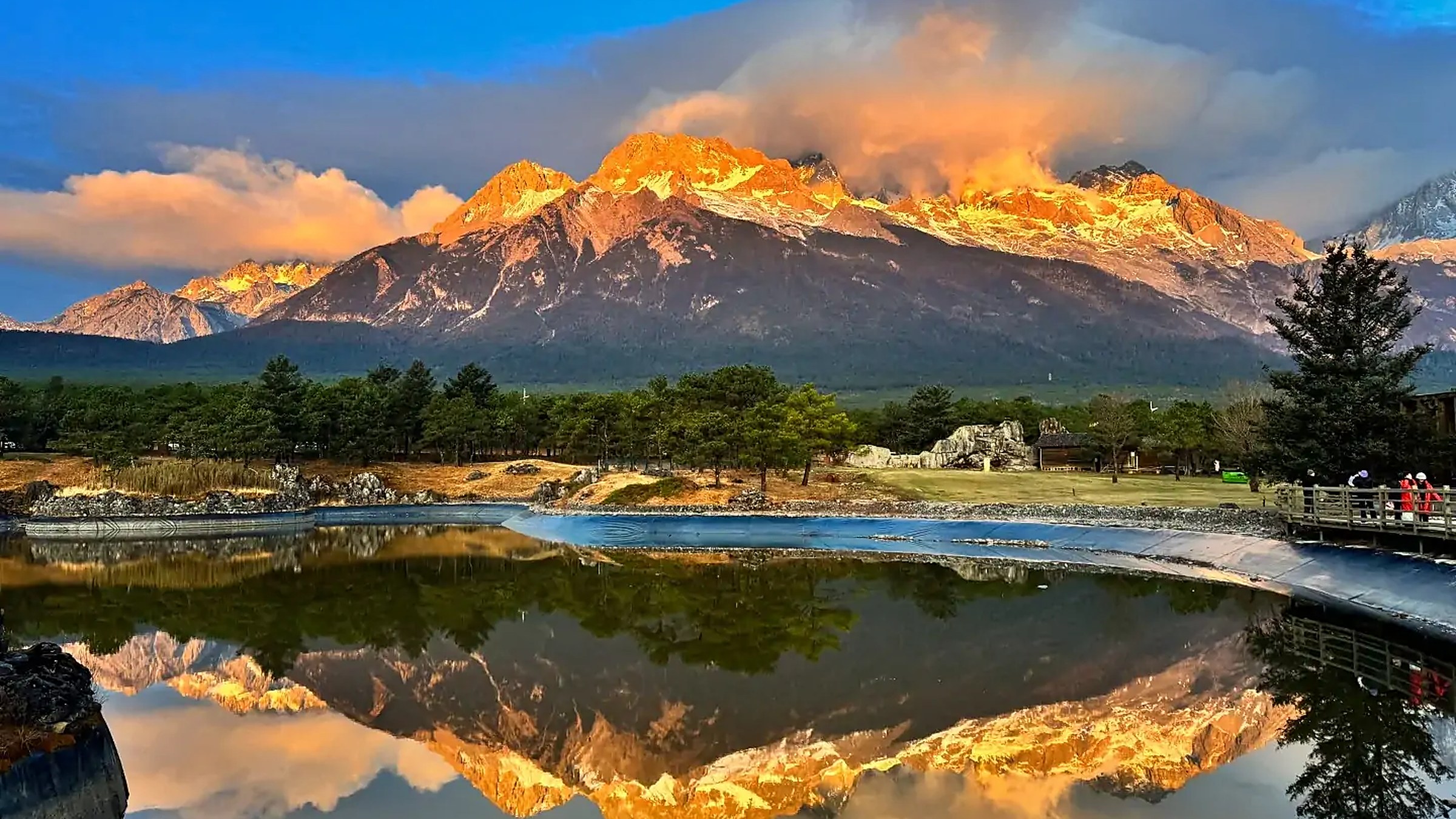 Jade Dragon Snow Mountain reflected in Black Dragon Pool at sunrise