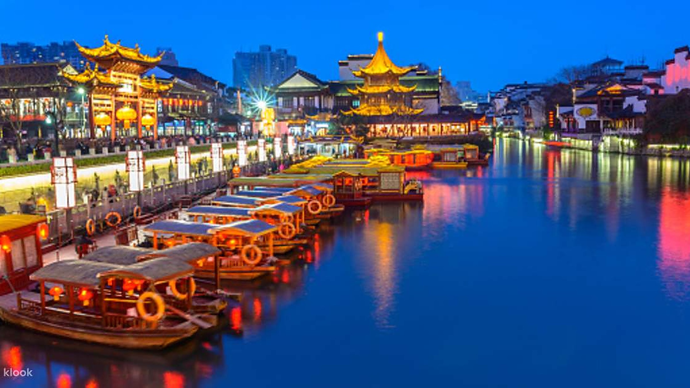 Nanjing Confucius Temple at night with red lanterns reflecting in the Qinhuai River
