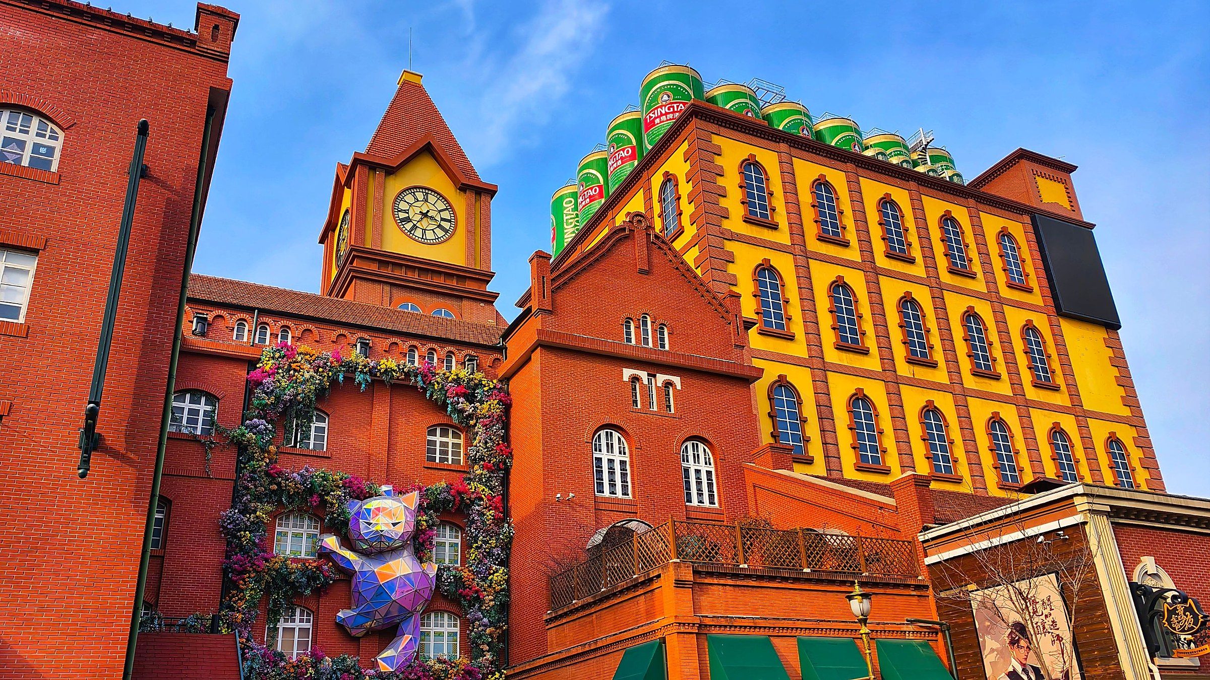 Tsingtao Beer Museum with the four iconic green beer cans and clock tower