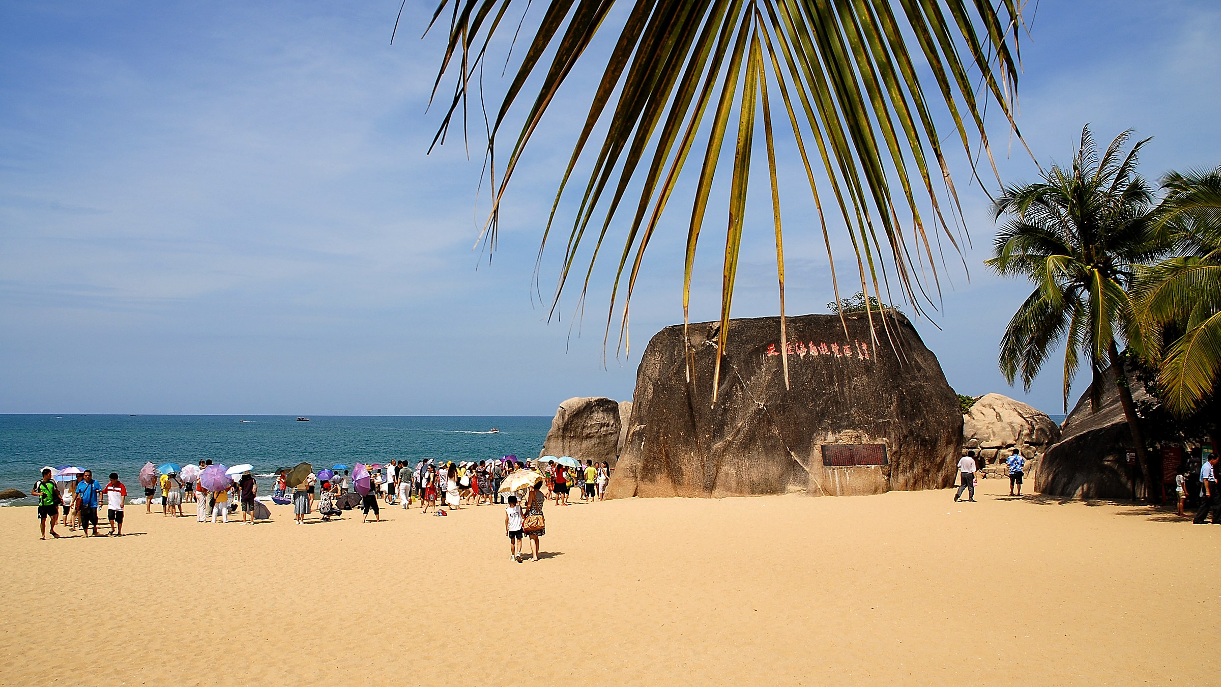 Tianya Haijiao (天涯海角) — the iconic "Edge of the Sky, Corner of the Sea" rocky coast with ancient stone inscriptions, Sanya's most-photographed landmark.