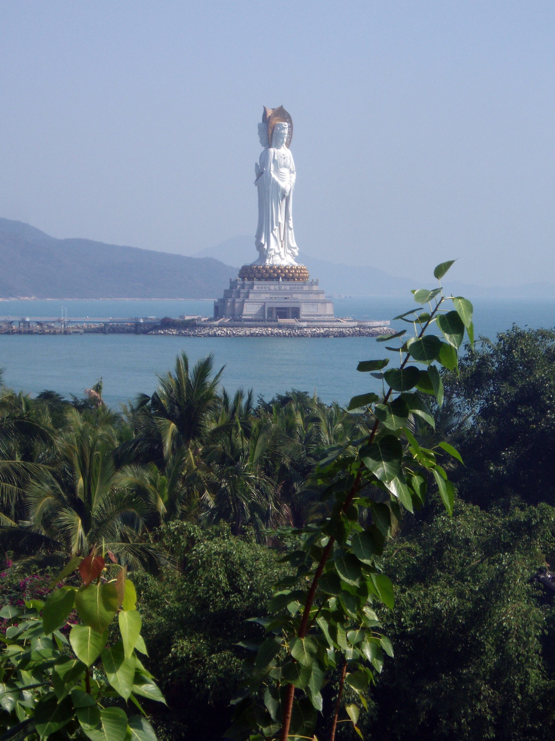 Nanshan Temple + 108m Guanyin (南山) — a 1,100-year-old Buddhist temple complex on the southern coast, with the 108m three-sided Guanyin statue (one of the world's tallest).