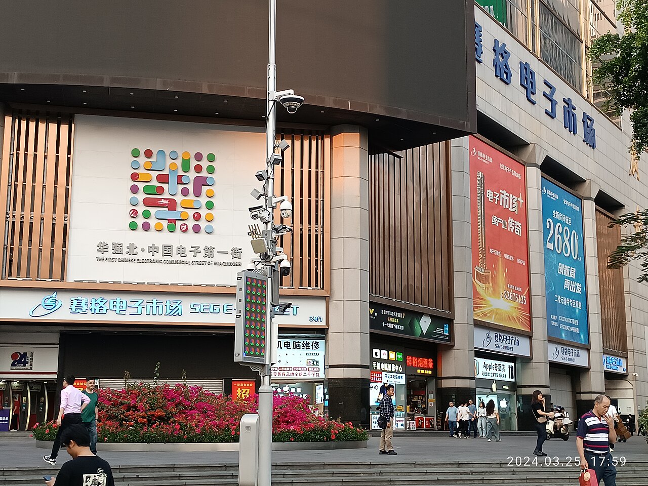 Huaqiang North electronics market — interior counter booths selling mobile phones, components, and electronics