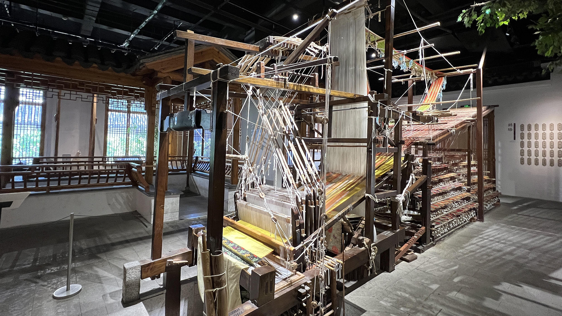 Suzhou Silk Museum — traditional wooden silk looms from the city's 5,000-year silk-making tradition.