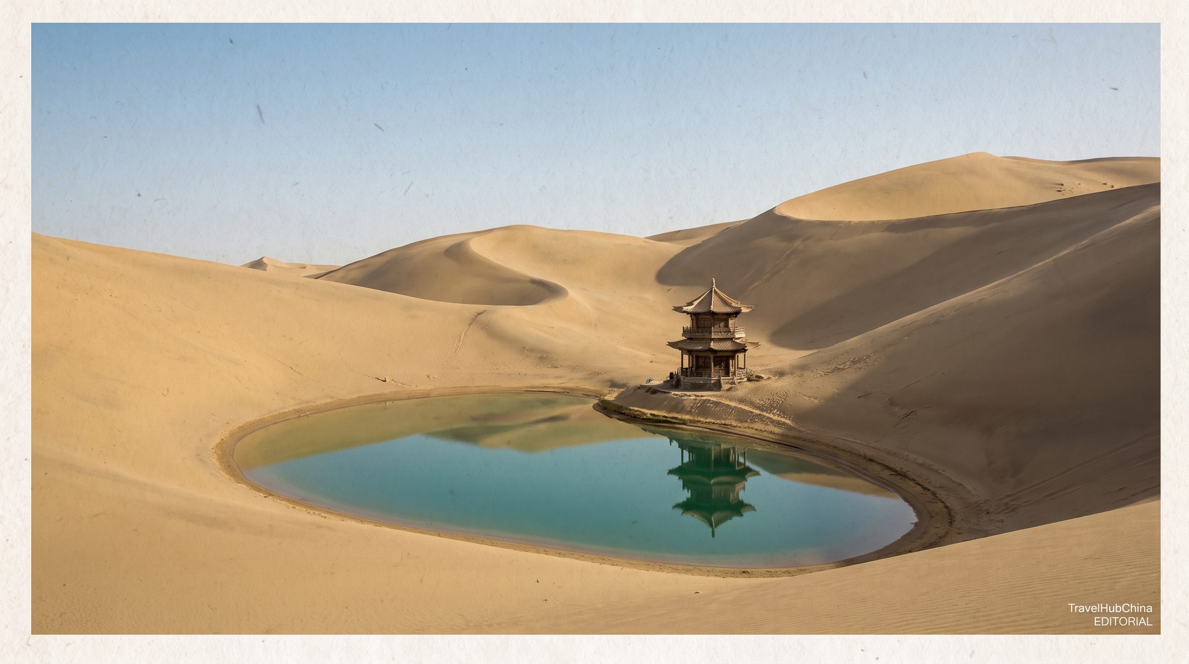 The Crescent Lake oasis at Dunhuang, a small half-moon shaped pool of water surrounded by desert and the dunes of Mingsha Shan
