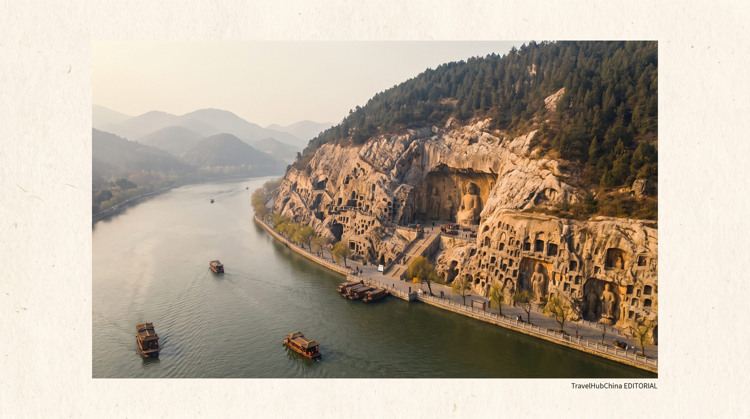 Aerial view of the Longmen Grottoes with the Yi River cutting through the limestone cliffs at Luoyang, showing the West Gate entrance and the long line of cave niches carved into both banks
