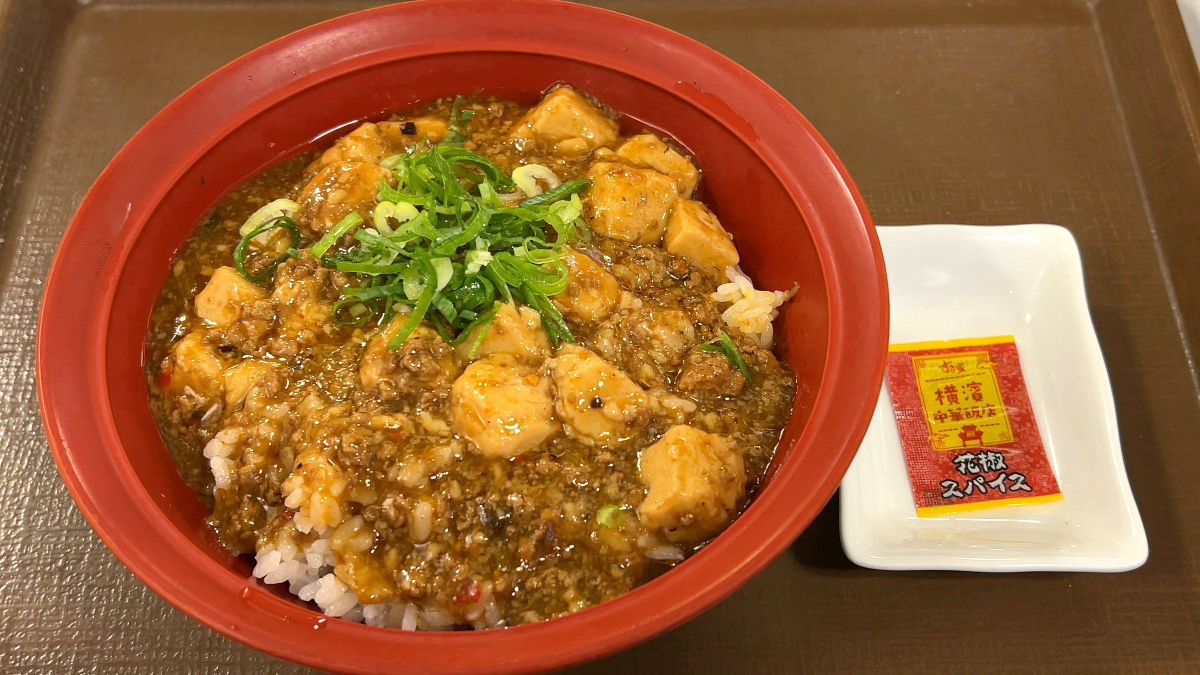 Sichuan cuisine guide — mapo tofu with Sichuan peppercorns, served over rice in a red bowl