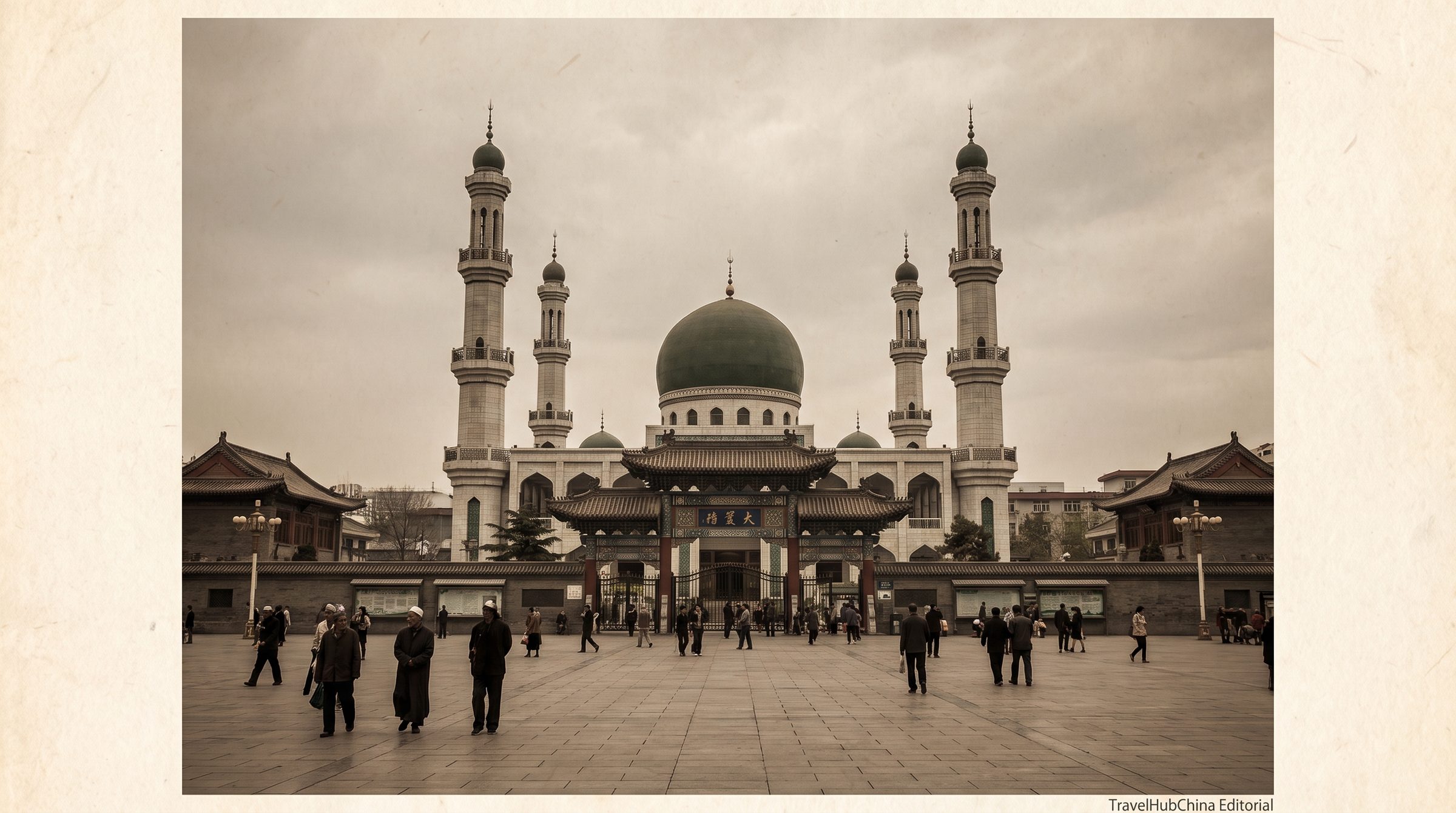 The Dongguan Mosque in Xining, with the green dome and the tall minarets rising above the surrounding Hui quarter buildings under late afternoon light